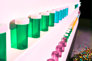 shelf full of empty pill bottles
